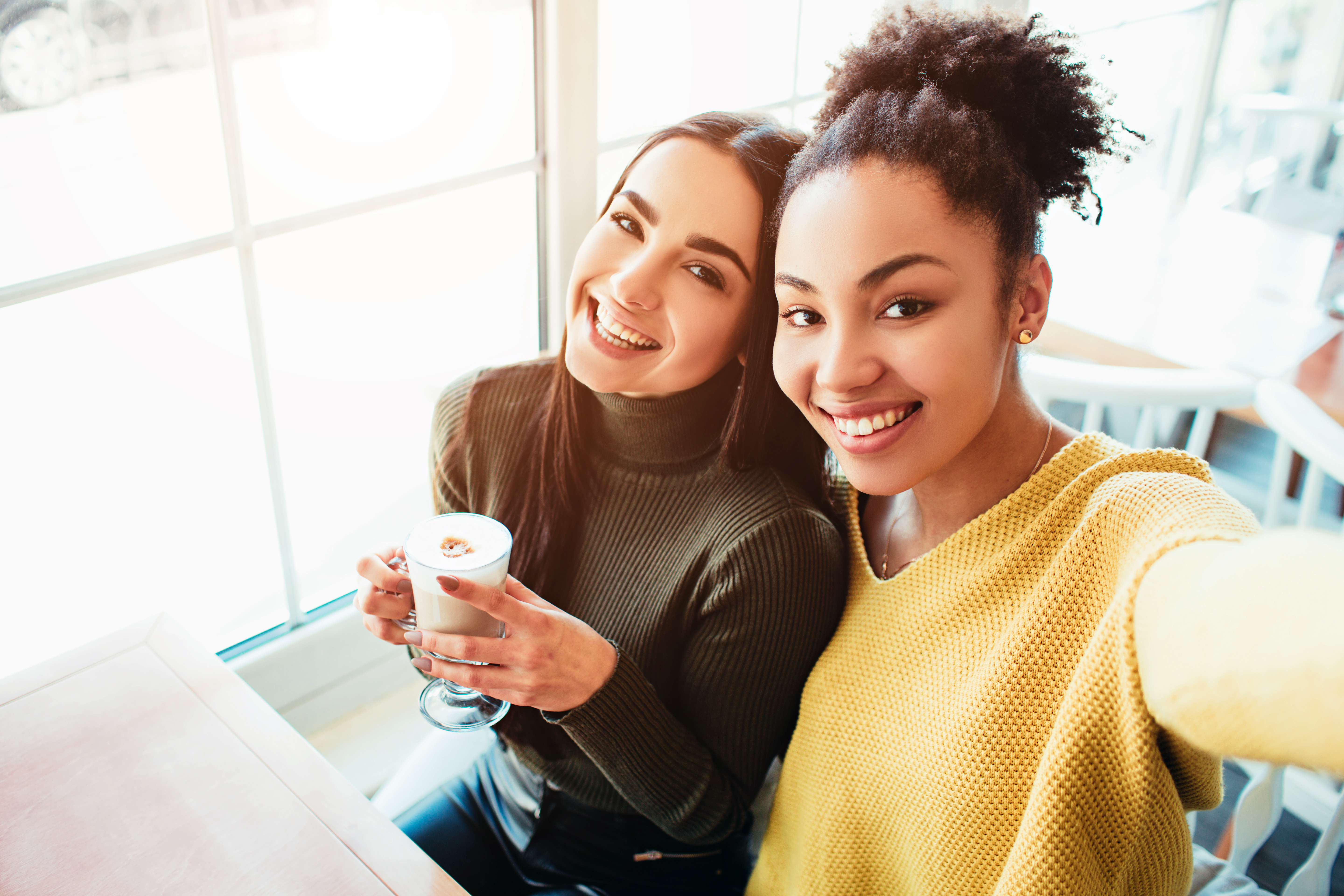 two college-aged women take a selfie together